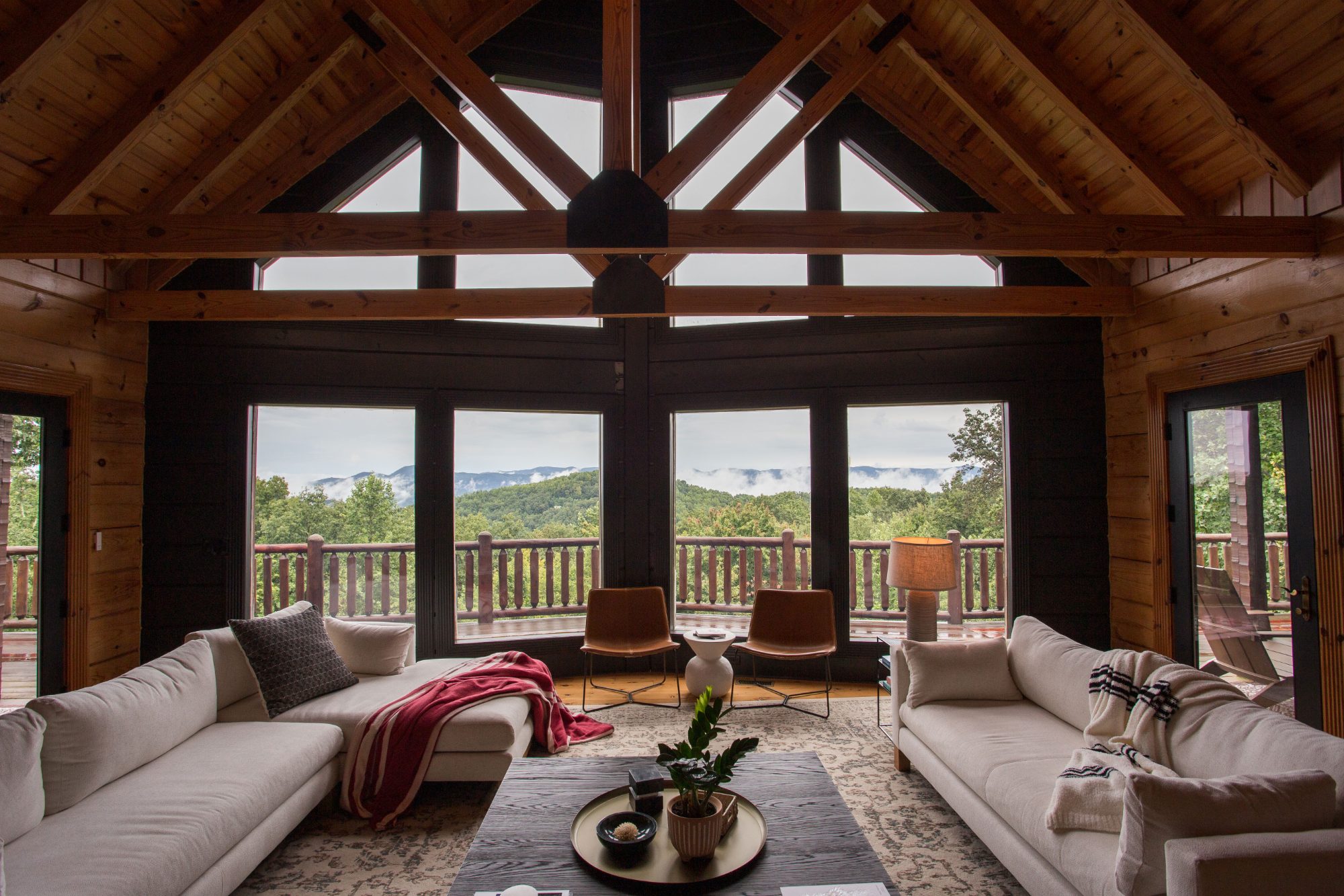The Ridge great room — floor-to-ceiling windows framing Grandfather Mountain
